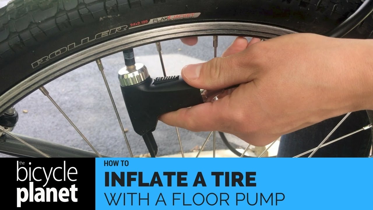 An application scenario or product detail of how to inflate a bike tire with a pump - Image 4
