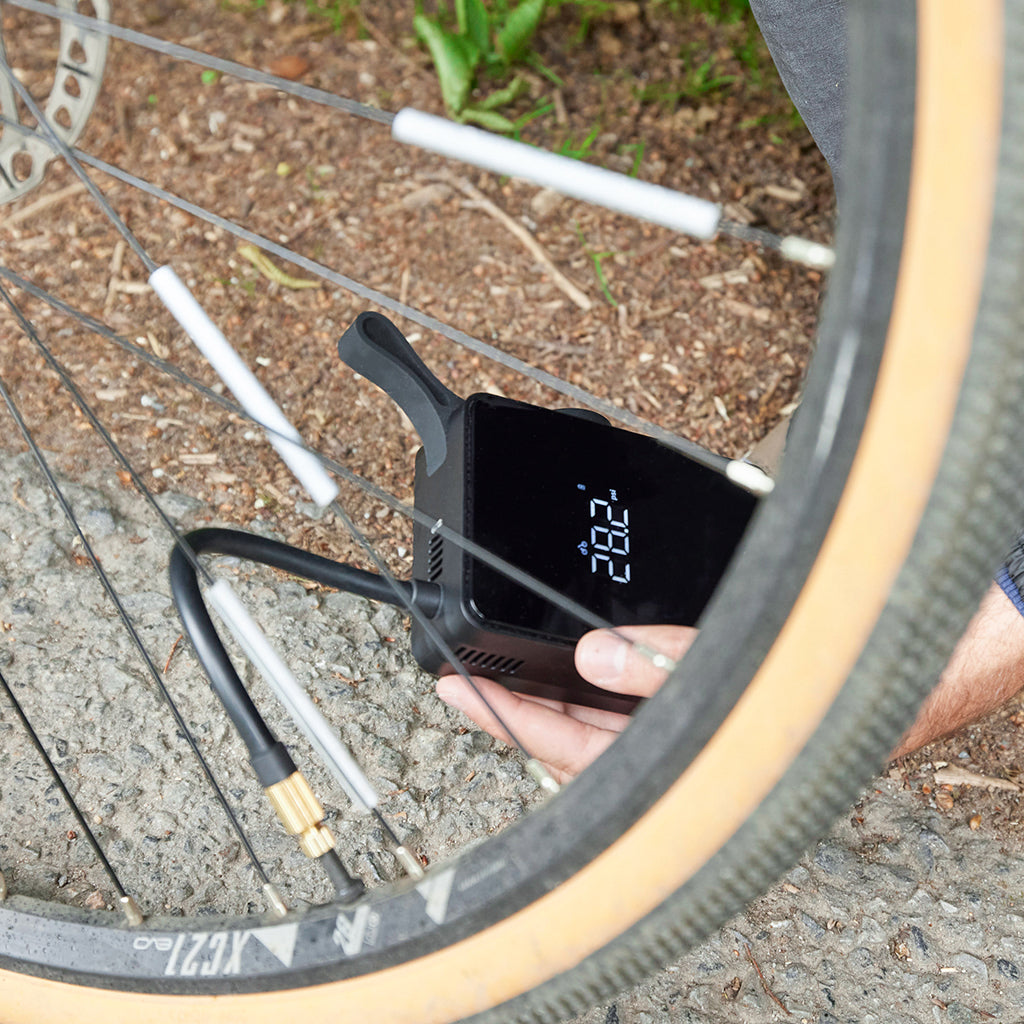 An application scenario or product detail of how to inflate a bike tire with a pump - Image 21